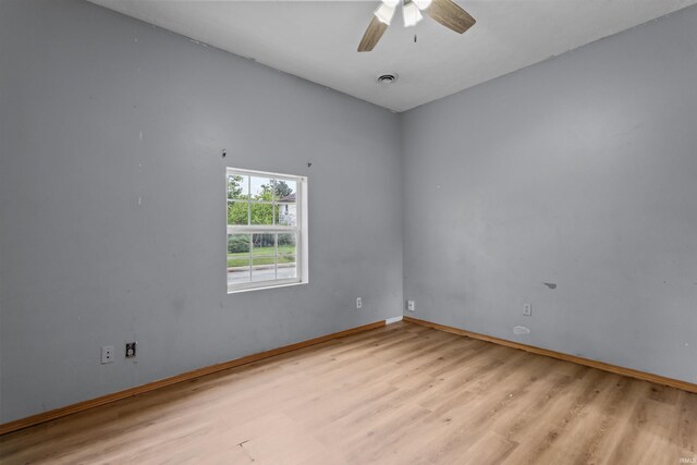 1227 S Main St, Kokomo, IN 46902 - spare room with light wood-style floors, ceiling fan, and baseboards