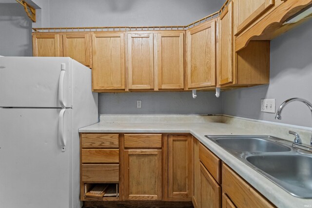 1227 S Main St, Kokomo, IN 46902 - kitchen with freestanding refrigerator, a sink, and light countertops