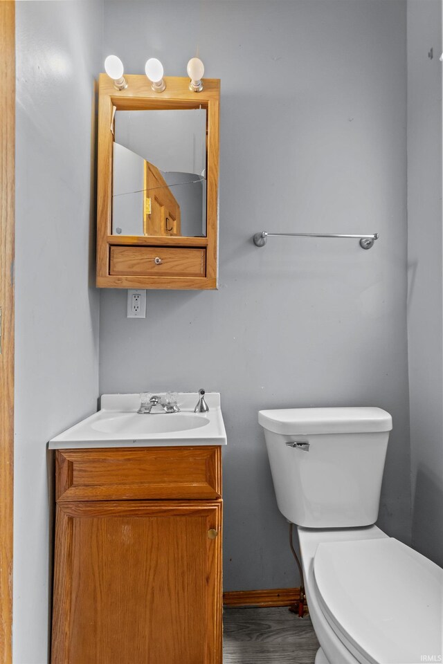 1227 S Main St, Kokomo, IN 46902 - bathroom with toilet, vanity, and baseboards