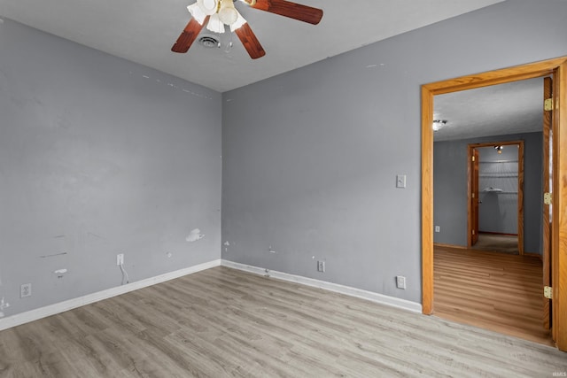 1227 S Main St, Kokomo, IN 46902 - spare room featuring wood finished floors, ceiling fan, and baseboards