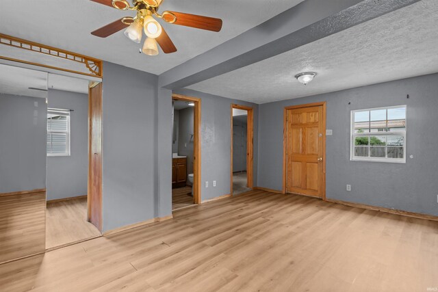 1227 S Main St, Kokomo, IN 46902 - empty room with wood finished floors, baseboards, and ceiling fan