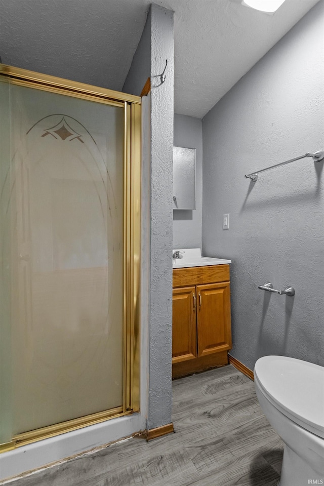 1227 S Main St, Kokomo, IN 46902 - full bathroom with vanity, a shower stall, wood finished floors, toilet, and baseboards