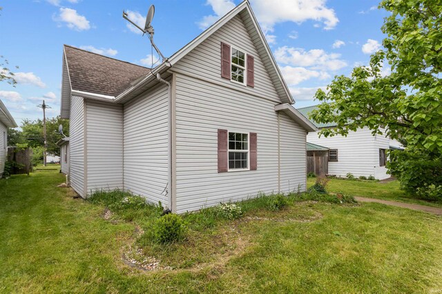 1227 S Main St, Kokomo, IN 46902 - view of side of home with roof with shingles and a yard