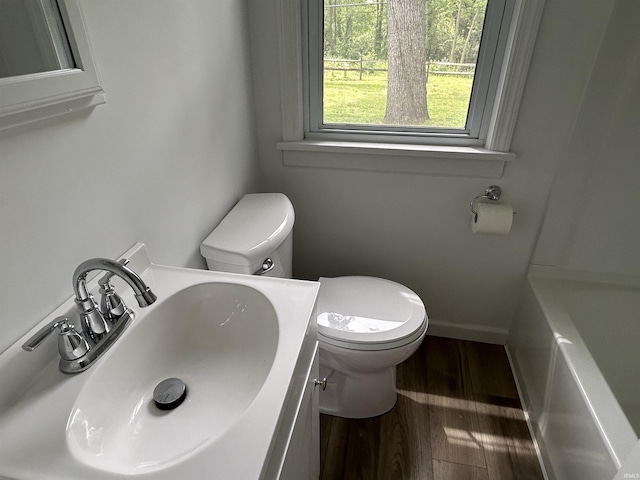 3534 Oakcrest Dr, South Bend, IN 46615 - full bath featuring a sink, toilet, wood finished floors, a bathtub, and a shower