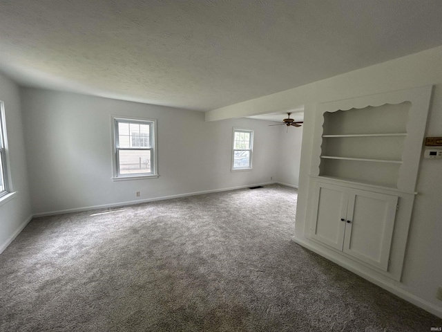3534 Oakcrest Dr, South Bend, IN 46615 - carpeted empty room with plenty of natural light, baseboards, ceiling fan, and a textured ceiling