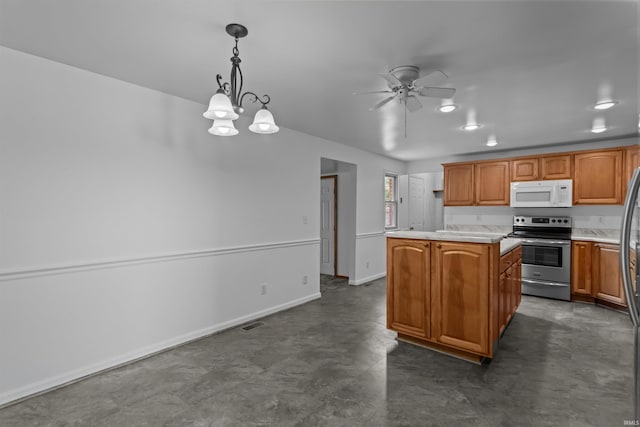 kitchen with white microwave, stainless steel electric range, a kitchen island, ceiling fan, and light countertops