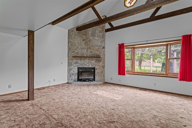 unfurnished living room featuring carpet, beam ceiling, a fireplace, high vaulted ceiling, and baseboards