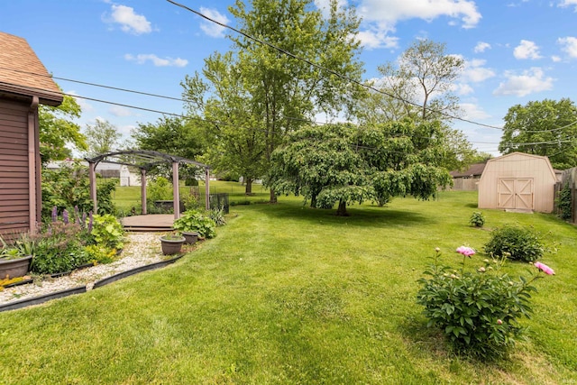 view of green lawn featuring a pergola