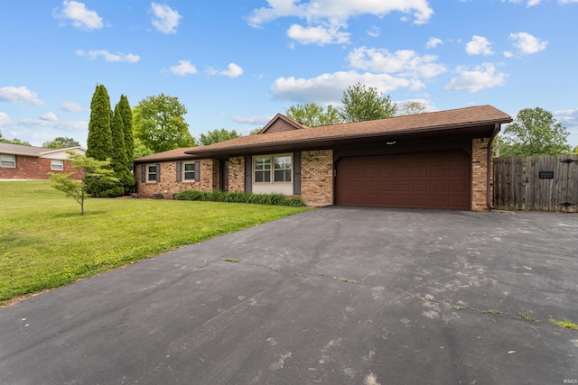 ranch-style home featuring driveway, a garage, and brick siding