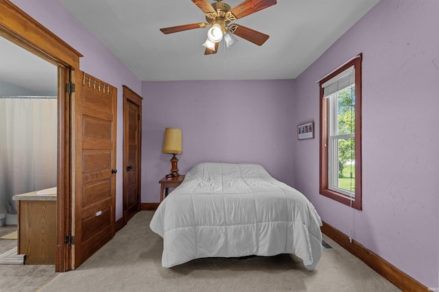 bedroom with carpet, baseboards, and ceiling fan