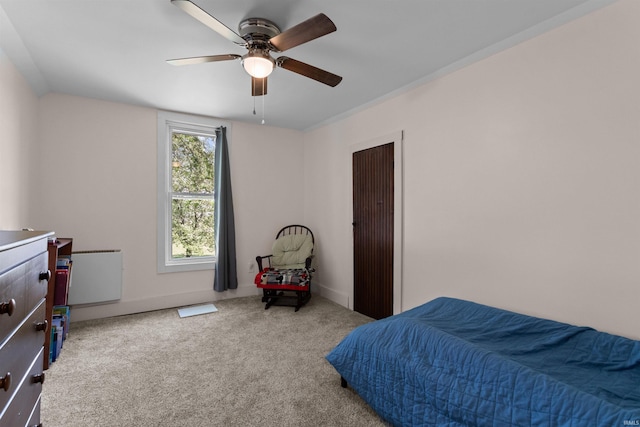carpeted bedroom featuring a ceiling fan