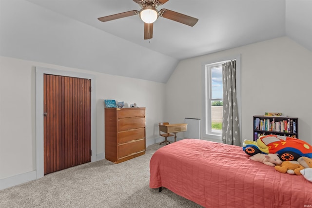 carpeted bedroom with lofted ceiling and ceiling fan