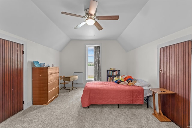 bedroom with carpet floors, lofted ceiling, ceiling fan, and baseboards
