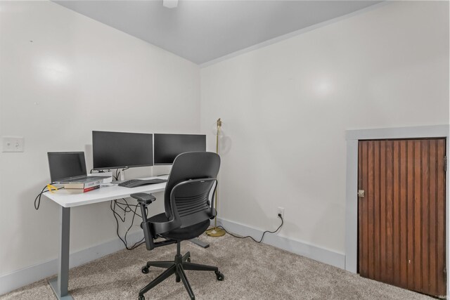 carpeted office space with baseboards