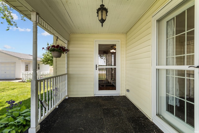 view of exterior entry featuring a porch