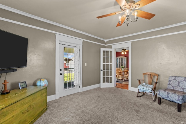 sitting room featuring ceiling fan, carpet floors, crown molding, french doors, and baseboards