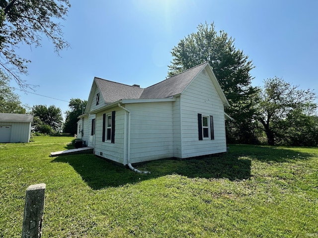 7831 S State Road 19, Peru, IN 46970 - view of home's exterior featuring a yard and roof with shingles