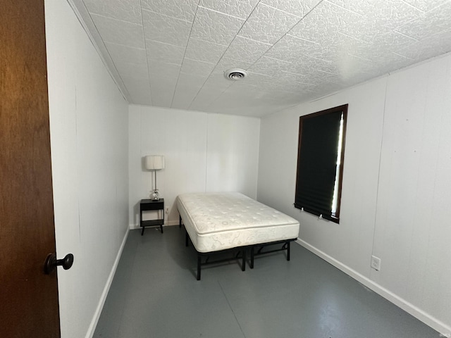 7831 S State Road 19, Peru, IN 46970 - bedroom with concrete flooring and baseboards