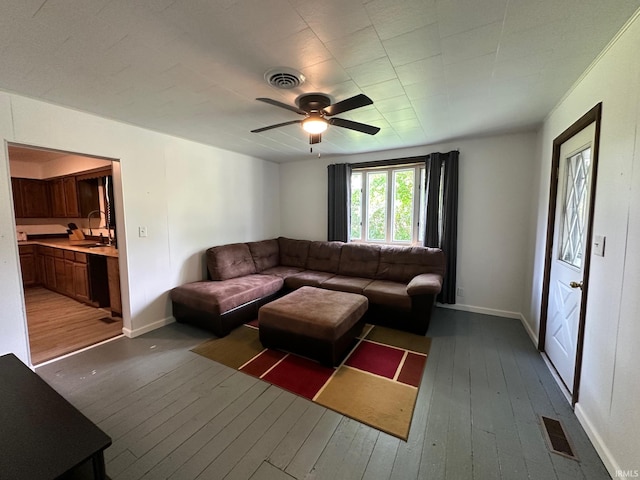 7831 S State Road 19, Peru, IN 46970 - living area with hardwood / wood-style flooring, a ceiling fan, and baseboards