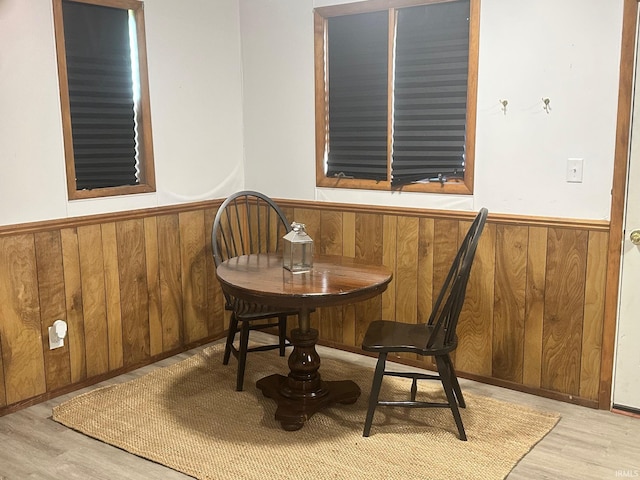 7831 S State Road 19, Peru, IN 46970 - dining room featuring a wainscoted wall, wood finished floors, and wood walls