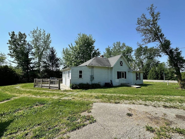 7831 S State Road 19, Peru, IN 46970 - view of side of property featuring a wooden deck and a yard
