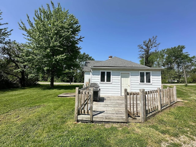 7831 S State Road 19, Peru, IN 46970 - back of property with a deck, a lawn, and roof with shingles
