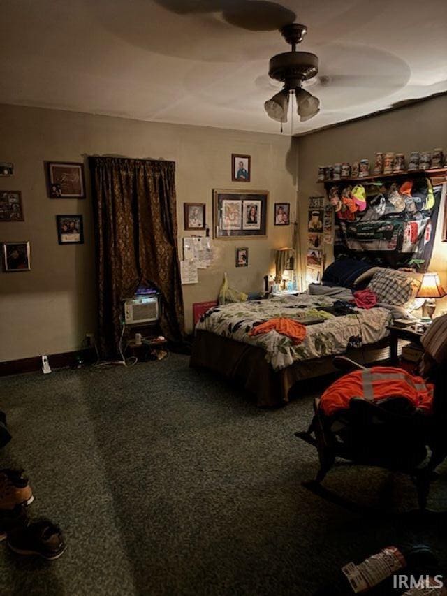 109 E Water St, Montpelier, IN 47359 - carpeted bedroom featuring ceiling fan and baseboards