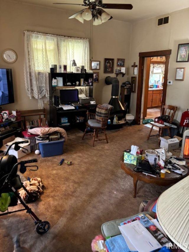 109 E Water St, Montpelier, IN 47359 - living area featuring ceiling fan and carpet floors