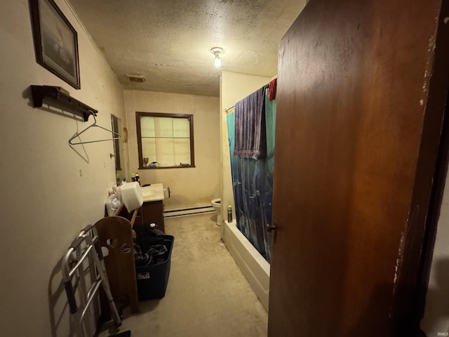 9615 S Olive St, Muncie, IN 47302 - bathroom featuring vanity, toilet, a baseboard radiator, bathtub / shower combination, and a textured ceiling