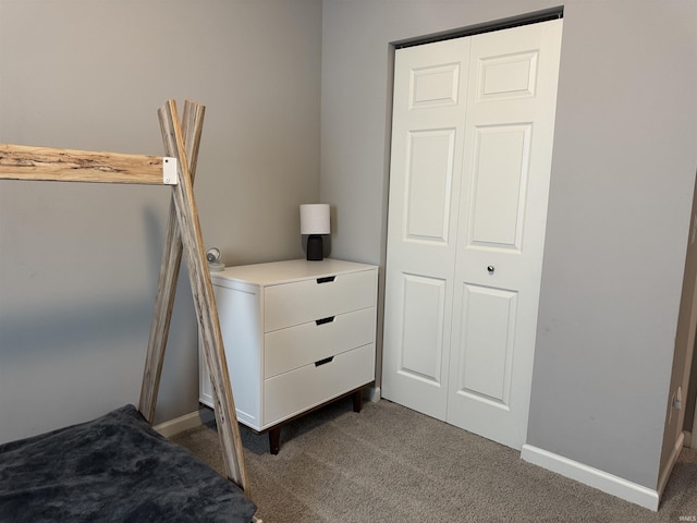 716 Gentry Ln, New Carlisle, IN 46552 - bedroom featuring dark colored carpet, baseboards, and a closet