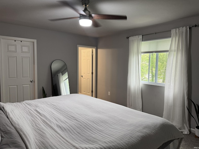 716 Gentry Ln, New Carlisle, IN 46552 - bedroom featuring carpet flooring, a ceiling fan, and baseboards