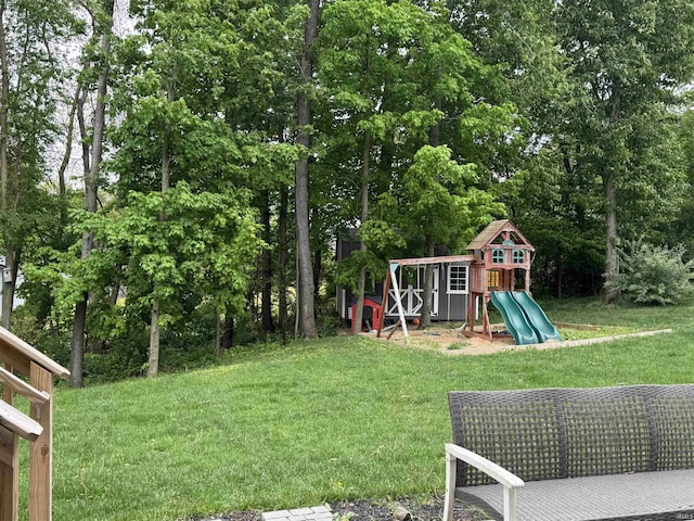 716 Gentry Ln, New Carlisle, IN 46552 - view of grassy yard with a playground and view of scattered trees