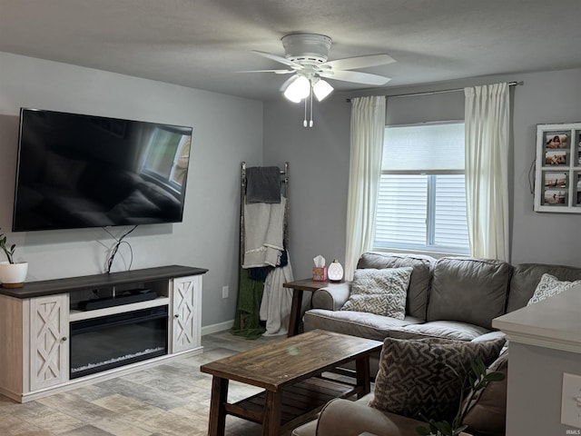 716 Gentry Ln, New Carlisle, IN 46552 - living area featuring a ceiling fan, light wood-type flooring, and baseboards
