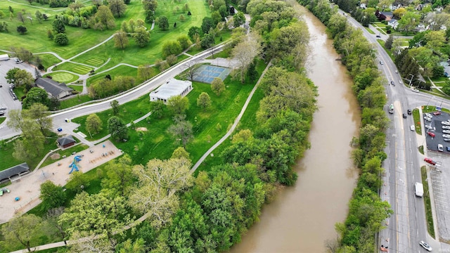 aerial view of property's location featuring a tree filled landscape