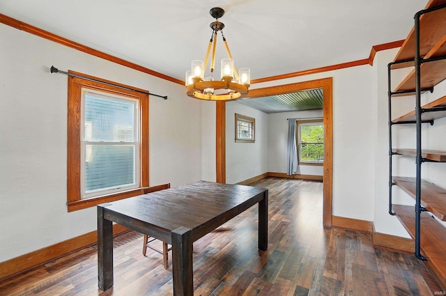 dining space featuring a chandelier, ornamental molding, baseboards, and dark wood-style flooring