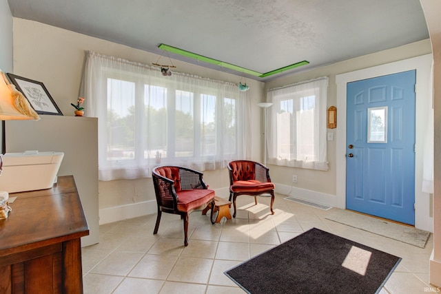 121 Diehl St, Tipton, IN 46072 - entrance foyer with healthy amount of natural light and light tile patterned flooring