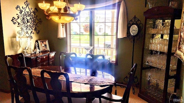 7751 E Fibia Pl, Fort Wayne, IN 46818 - dining room featuring a chandelier and carpet