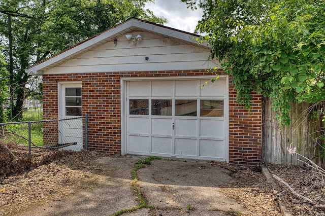 1616 N Roosevelt Dr, Evansville, IN 47711 - garage with fence and asphalt driveway