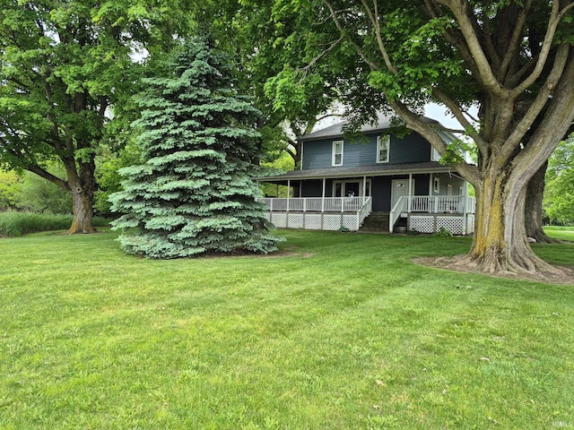 1239 County Road 28th Rd, Corunna, IN 46730 - view of green lawn with a porch