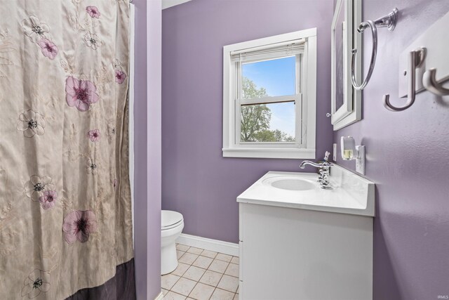 1239 County Road 28th Rd, Corunna, IN 46730 - full bath with vanity, toilet, tile patterned floors, and baseboards