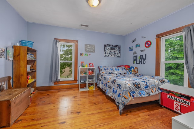 1239 County Road 28th Rd, Corunna, IN 46730 - bedroom with hardwood / wood-style flooring and multiple windows