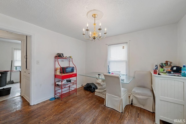 721 S Wellington St, South Bend, IN 46619 - dining space featuring a chandelier, wood finished floors, healthy amount of natural light, and a textured ceiling