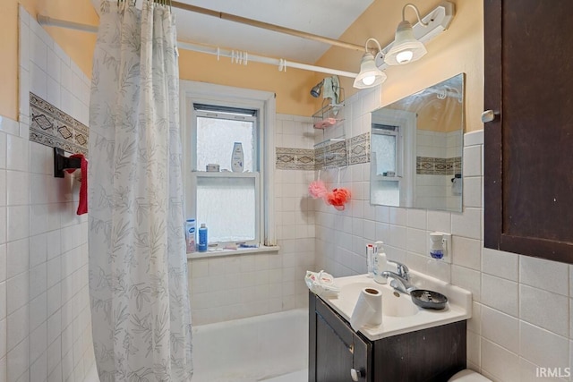 721 S Wellington St, South Bend, IN 46619 - bathroom with tile walls, shower / tub combo with curtain, and vanity