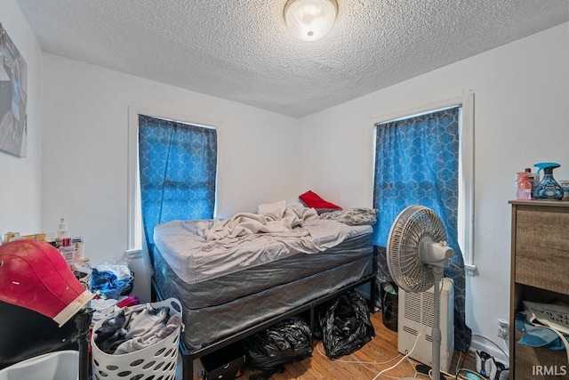 721 S Wellington St, South Bend, IN 46619 - bedroom featuring wood finished floors and a textured ceiling