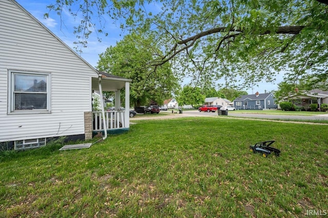 721 S Wellington St, South Bend, IN 46619 - view of grassy yard with a porch