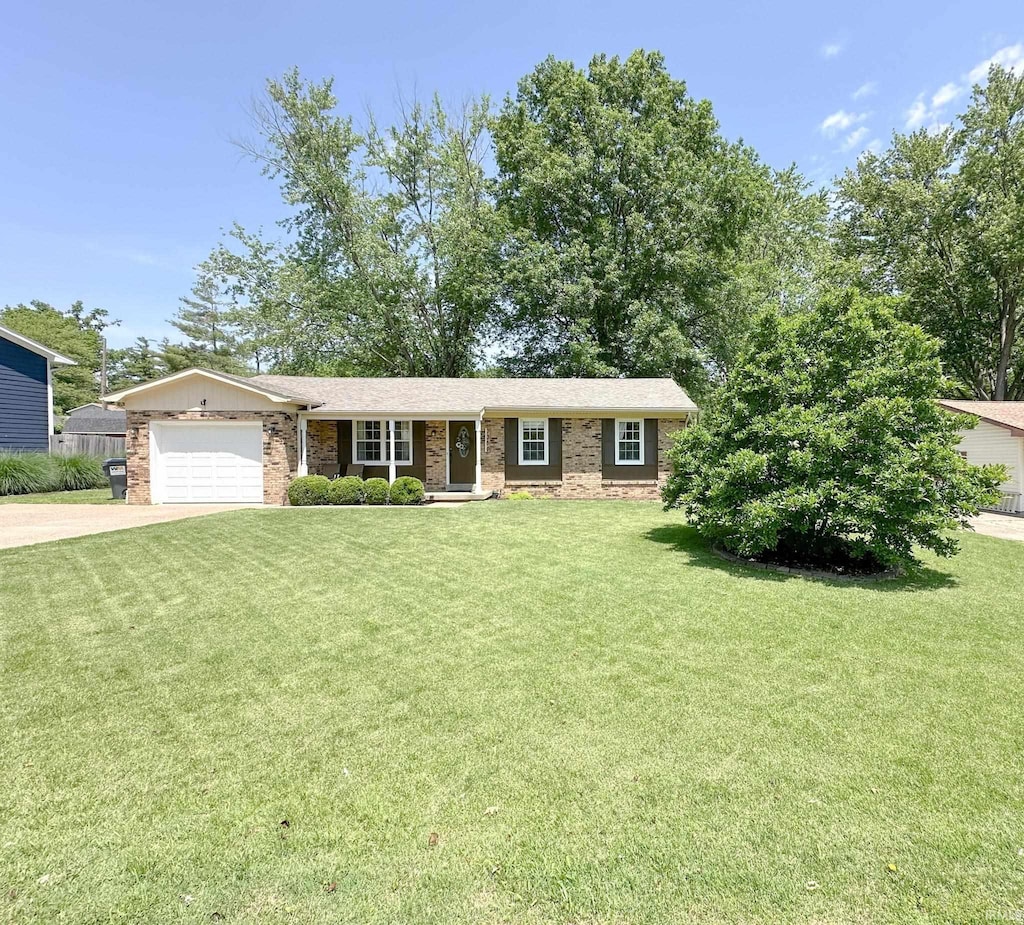 7366 Acorn Dr, Newburgh, IN 47630 - view of front of house with concrete driveway, an attached garage, and brick siding