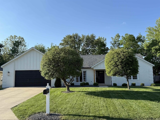 4104 W Friar Dr, Muncie, IN 47304 - view of front of home featuring board and batten siding, brick siding, and a front yard