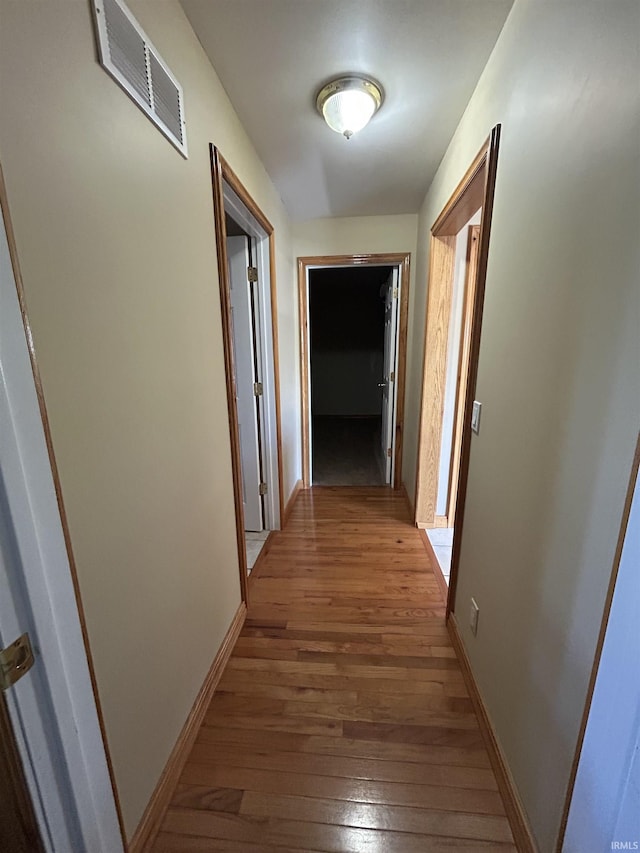 312 W Columbia St, Oakland City, IN 47660 - hallway with wood-type flooring and baseboards