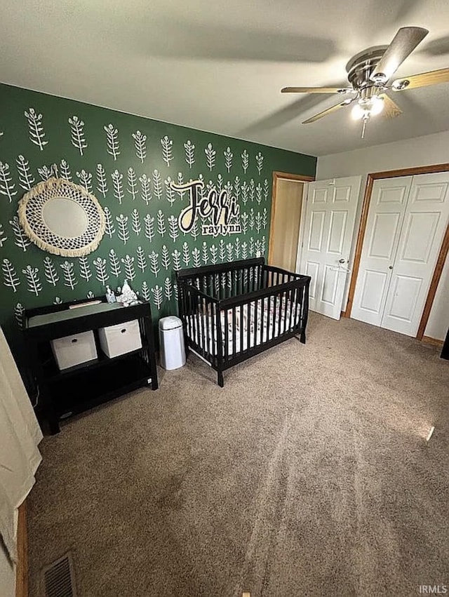 312 W Columbia St, Oakland City, IN 47660 - carpeted bedroom featuring a nursery area and a ceiling fan