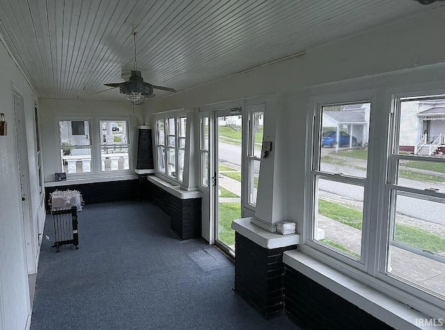 312 W Columbia St, Oakland City, IN 47660 - unfurnished sunroom with plenty of natural light and carpet flooring